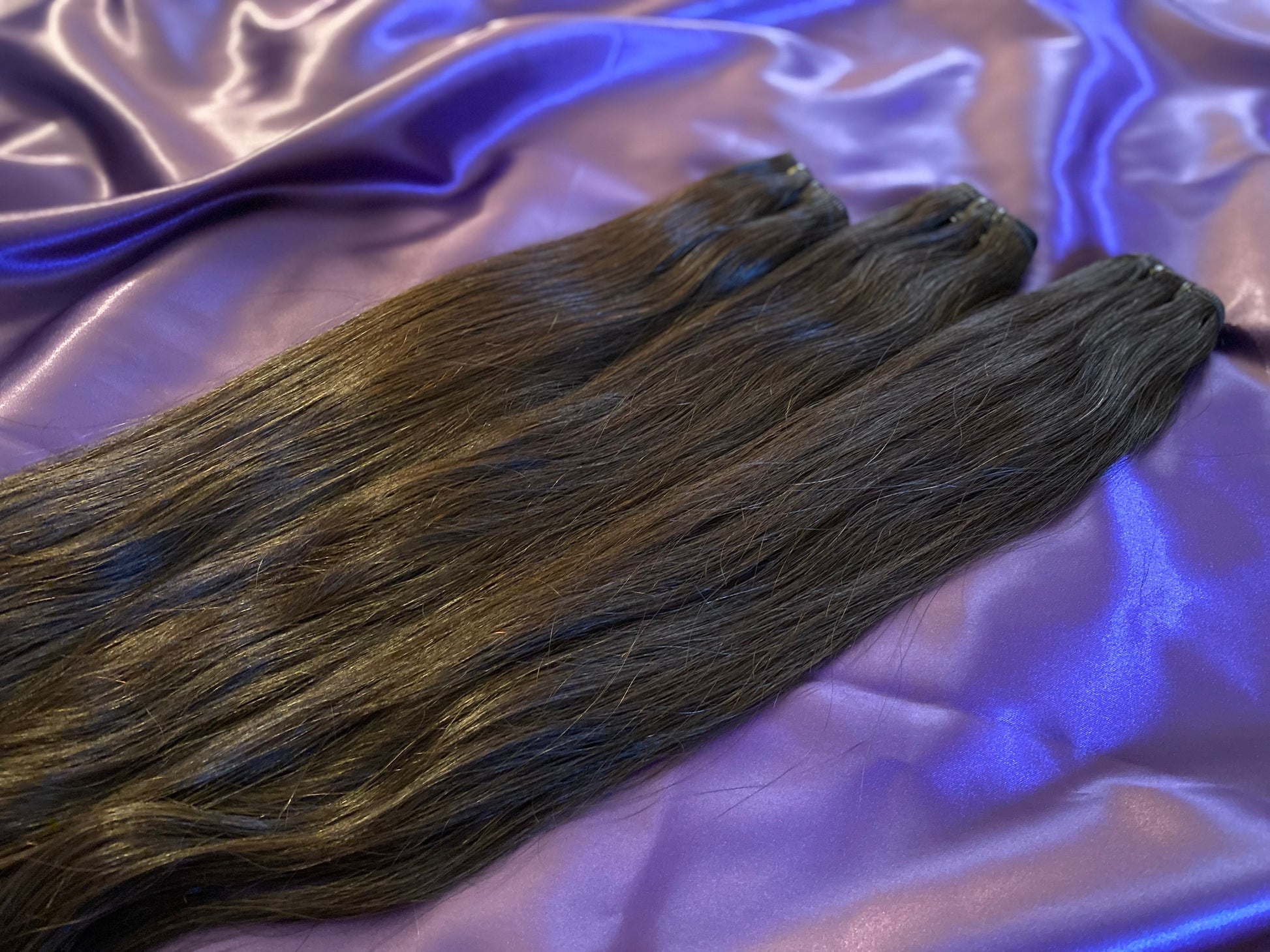 Raw straight hair extensions that offer a luxurious natural finish